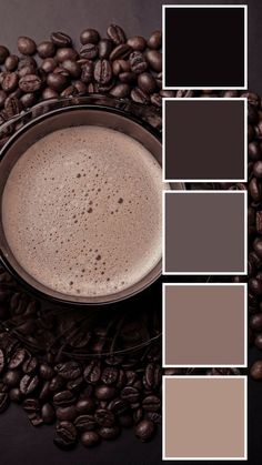 a cup of coffee sitting on top of beans next to some brown and black colors