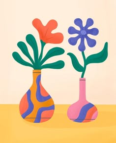 two colorful vases with flowers in them on a yellow tableclothed surface, one is pink and the other is blue