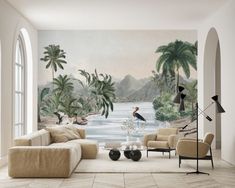 the living room is decorated with tropical wallpapers and large paintings on the walls