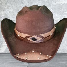 Add Some Western Flair To Your Wardrobe With This Cattleman Cowboy Hat Ranch Style. Made In Mexico With A Suede-Like Fabric, This Vintage Hat Features A Solid Pattern In Brown Color. The Hat Is Designed For Men And Has A Size Of M. It Is Perfect For Travel Occasions And Is Suitable For Those Who Love Western Or Cowboy Themes. The Cowboy Hat Has A Traditional Style With A Cowboy Or Ranchero Look That Will Make You Stand Out From The Crowd. It's A Great Accessory For A Western-Themed Party Or Even Western Theme Party, Cowboy Theme, The Cowboy, Stylish Hats, Vintage Hat, Ranch Style, Cowboy Hat, Themed Party, Solid Pattern