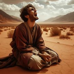 a man sitting in the desert with his eyes closed and mouth wide open looking up