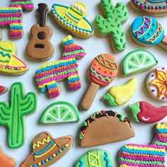 some decorated cookies are laying on a table