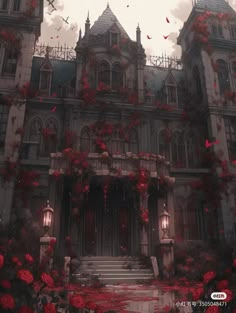 a large building with red flowers on the front and stairs leading up to it's entrance