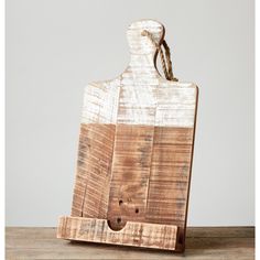 a wooden cutting board with a rope on it