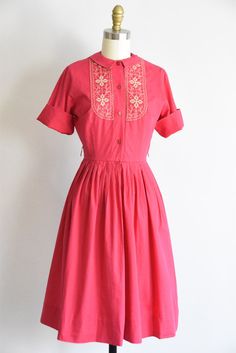 "Vintage 1960s cotton shirtwaist dress. Hot pink with neutral stitch embroidery on bodice. Petite one and half inch collar, fold over sleeve cuffs, and nipped waist. Free skirt. Loops for belt, no belt. Front button closure. State of garment | good, overall wear with areas of color fade (near collar, on shoulders and down front). Refer to photos and request additional photos if needed. Best fit | Extra Small / Small bust | up to 35\" shoulders | 13.5 \" shoulder to waist | 15 \" sleeves | 8.5 \" 1950 Shirtdress, Pink Spring Dress, Toothpaste Kisses, Pink Spring Dresses, 1960s Outfits, 1950s Dresses, Flora Dress, Shirtwaist Dress, Fantasy Closet