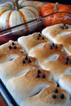 a baking dish with pumpkins in the background