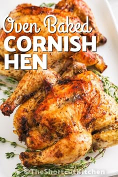 two cooked chicken on a white plate with the title overlay reads oven baked cornish hen