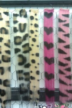 four pairs of animal print hair on display