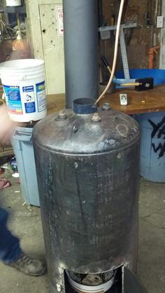 a large metal tank sitting on top of a wooden table