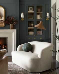 a living room filled with furniture and a fire place