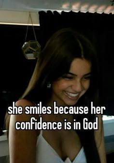 a woman with long hair smiling and texting she smiles because her confidence is in god