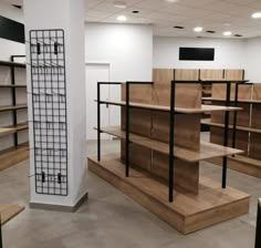 an empty room with shelves and shelving in the middle, some are made out of plywood