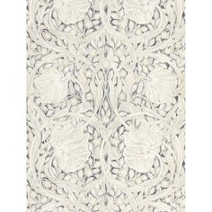 a white rug with an intricate design on it