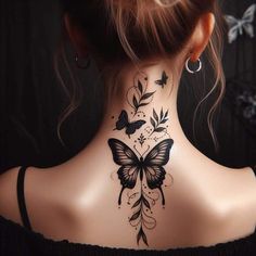 a woman's neck tattoo with butterflies on it