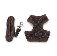 a brown dog harness and leash on a white background