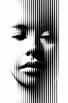 an artistic black and white photo of a woman's face with lines in the background