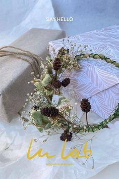 an image of a gift wrapped in paper and tied with twine on the table