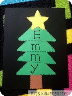 a christmas tree cut out on a piece of paper with the word merry written in it