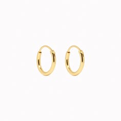 Our small gold hoop earrings are dainty and classic, making them perfect for everyday wear. Hoops measure at 12mm Gold Hoop Earrings Mini, Gold Earring Hoops, Small Gold Hoops Earrings, Gold Mini Hoop Earrings, Small Hoops Earrings, Gold Earing, Small Gold Earrings, Real Gold Earrings, Hoop Gold Earrings