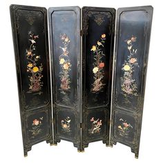 four - panel floral screen with birds and flowers painted on black lacquer, 19th century