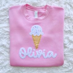 Our hand embroidered ice cream cone with sprinkles youth and toddler shirt features a felt "vanilla" ice cream cone with colorful sprinkles hand stitched onto a short sleeve t-shirt.  Shirts are available in light pink, light purple and teal (see photos).  If you're interested in another color that's not listed please message me and I will do my best to accommodate your request.  For a personalized touch, you can choose to add your child's name embroidered in white felt and thread under the ice Ice Cream Cone With Sprinkles, Embroidered Felt, Youth Shirt, Girls T Shirt, Personalized Embroidered, Vanilla Ice, Pink Light, Ice Cream Cone, Embroidered Shirt