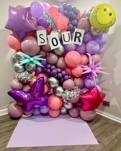 a balloon sculpture made to look like it has the words sour on it and balloons