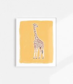 a giraffe standing in front of a yellow background on a white wall next to a plant