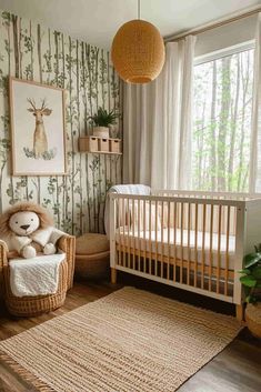 a baby's room with a crib, teddy bear and wallpaper