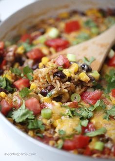 a white bowl filled with mexican rice and vegetables