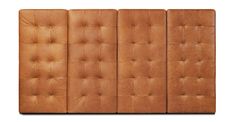 a set of four brown leather panels on a white background with no one in it