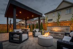 an outdoor patio with seating and fire pit