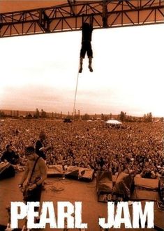 the poster for pearl jam is shown above an image of a man on a stage