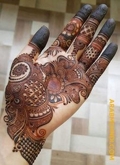 a hand that has some henna on it