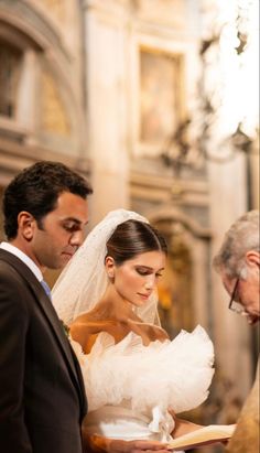 the bride and groom are getting ready to walk down the aisle