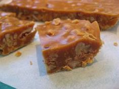 several pieces of food sitting on top of a piece of wax paper next to each other