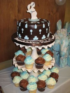 a cake and cupcakes on a table