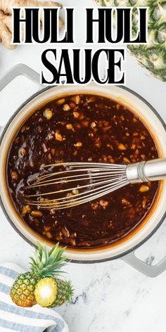 the sauce is being stirred in a pot with pineapples and other ingredients around it