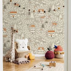 a baby's room with wallpaper and toys on the floor