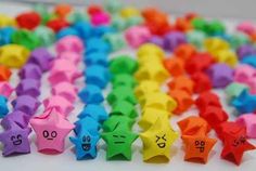 many different colored origami stars with numbers on them