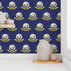 there is a blue wallpaper with an image of the united states air force on it