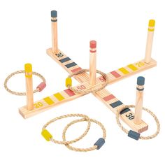 a wooden toy set with ropes and measuring tape