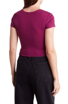 Corset-style seams add structure to a cropped length baby tee that features cap sleeves and rib knit construction. Crewneck Cap sleeves 58% Organic Cotton, 38% Recycled Polyester, 4% Spandex Machine wash, tumble dry Imported Model stats: 5'10" height, 32" bust, 25" waist, 36" hip. Model is wearing size S Basic Cropped Elastane Tops, Fitted Ribbed Cotton Crop Top, Fitted Elastane Short Sleeve Crop Top, Ribbed Stretch Cropped T-shirt, Cropped Ribbed T-shirt With Stretch, Cropped Ribbed Stretch T-shirt, Cropped Elastane Tops, Fitted Solid Crop Top With Ribbed Neckline, Fitted Ribbed Basic Cropped T-shirt