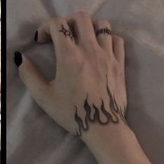 two pictures with tattoos on their hands and the same person's hand holding something