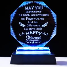 a blue crystal award with the words happy retirement on it's base and an inscription that reads, may you be proud of the work you have done