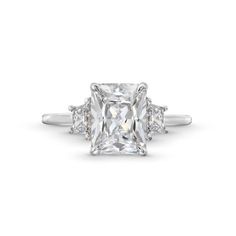 a cushion cut diamond ring with three side stones