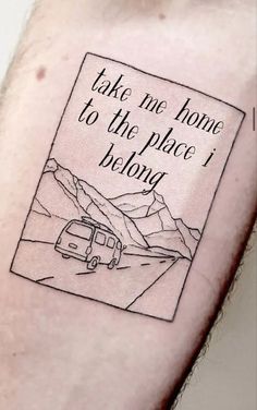 a person with a tattoo on their arm that says take me home to the place i belong