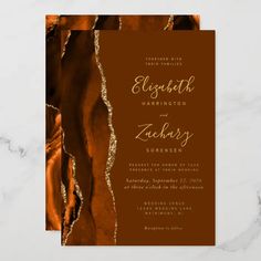 an orange and gold foil wedding card with the words, ellsworth harrison and elizabeth