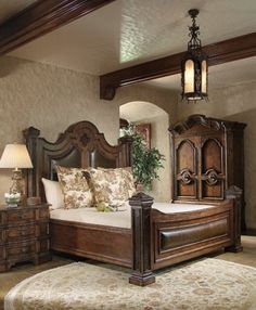 a bedroom with a large bed and wooden furniture