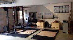 the garage is clean and ready to be used as a home gym or workout room