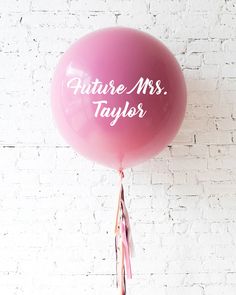 a pink balloon with the words future mrs taylor on it